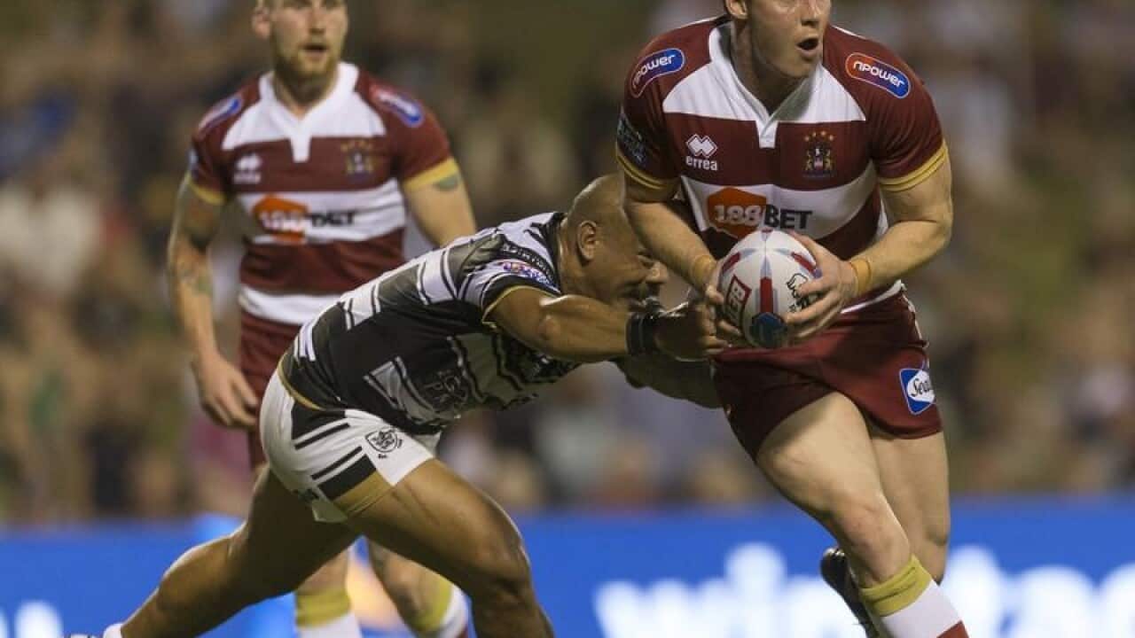 Joel Tomkins of the Warriors runs with the ball