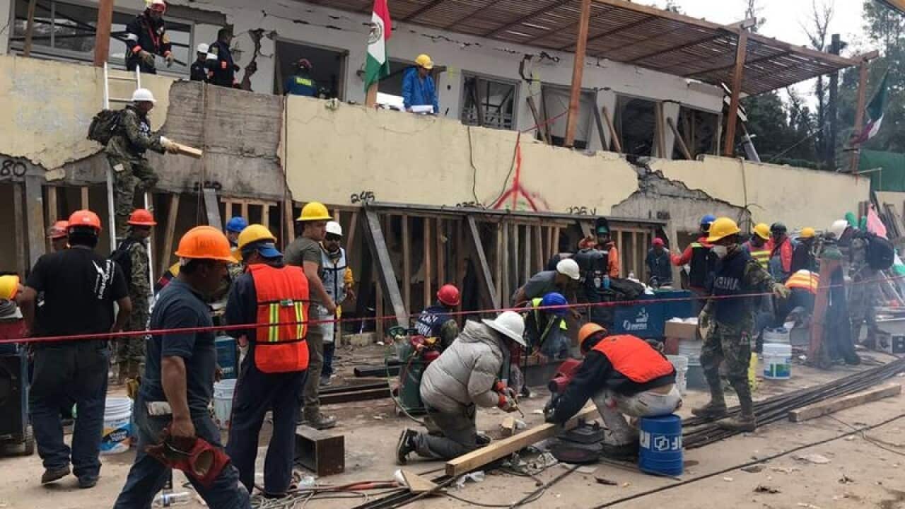 Rescue workers at the Enrique Rebsamen school