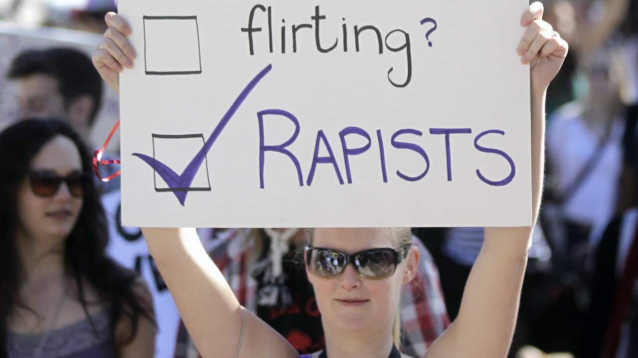 File photo: A woman carry a banner during a Slut Walk, walk that took place in the city of Cape Town, South Africa