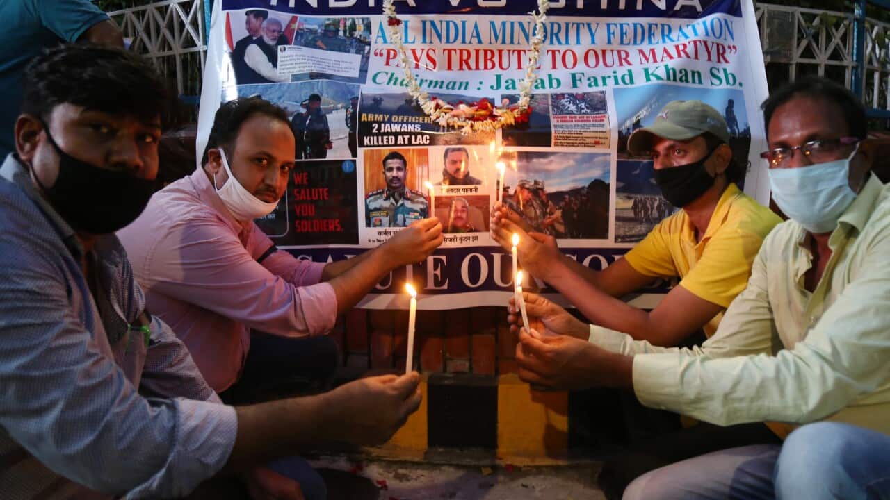 epa08490889 Indian activists hold candles as a tribute to Indian soldiers killed in clash with Chinese soldiers in Ladakh, Kolkata.