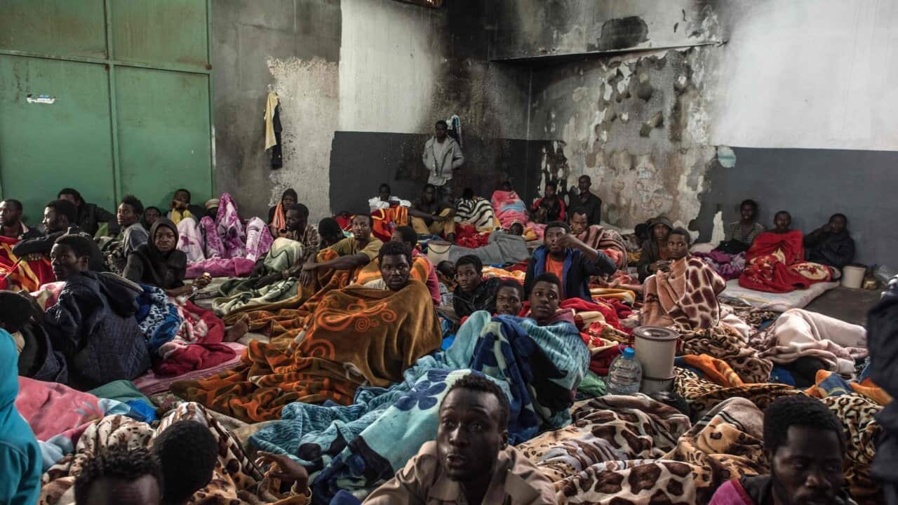 African migrants packed into the Tariq Al-Matar detention center on the outskirts of Tripoli, Libya, on Monday.