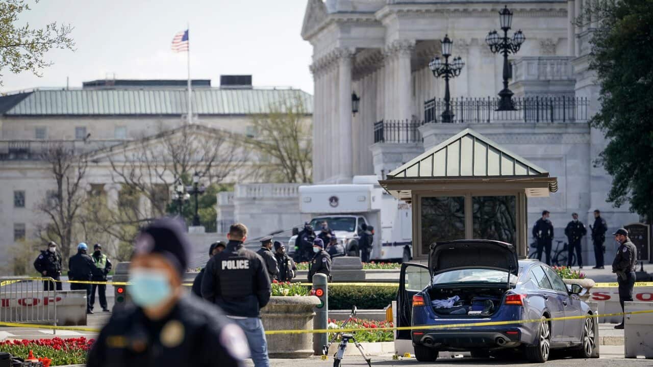 Police investigate the scene after a vehicle charged a barricade at the US Capitol on 2 April in Washington, DC.