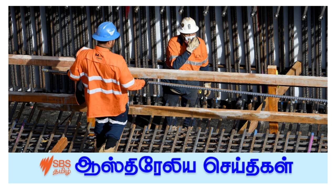 Construction workers are seen at the workplace