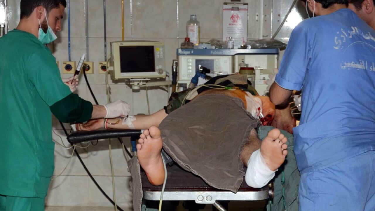 Doctors operating on an injured civilian at a hospital in Aleppo