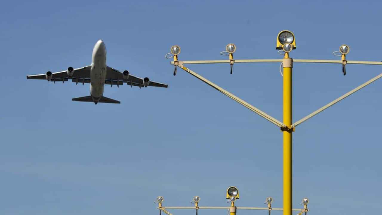 An aircraft seen departing Sydney International Airport, Sydney