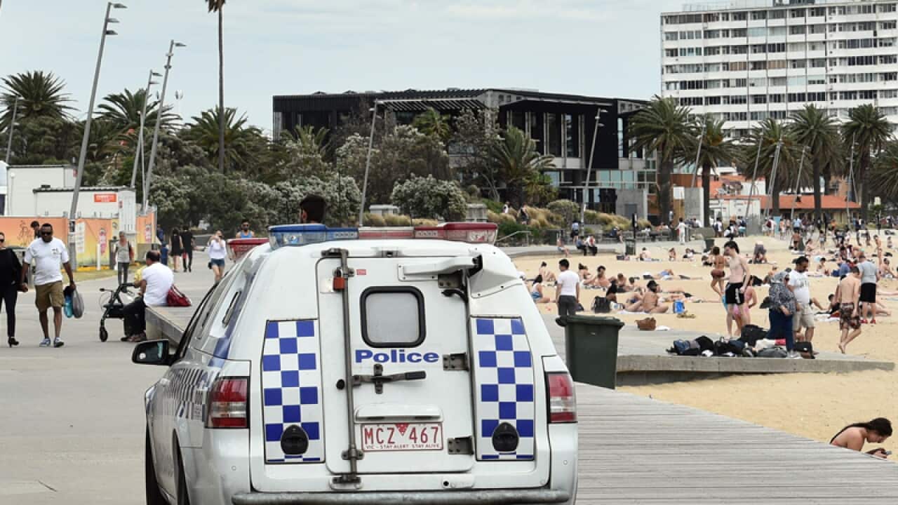 Police patrol St. Kilda beach in Melbourne