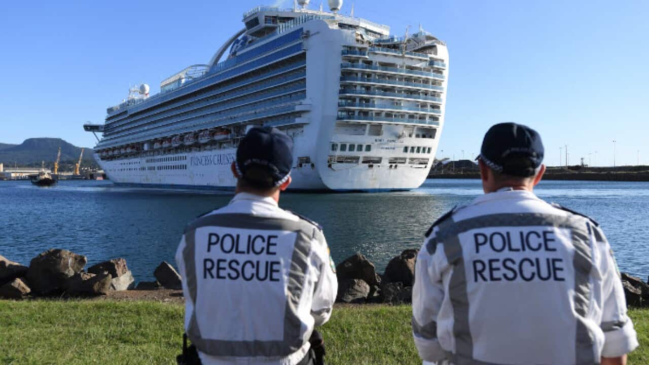 NSW Police Rescue officers look on as the Ruby Princess, with crew only onboard, docks at Port Kembla, Wollongong.
