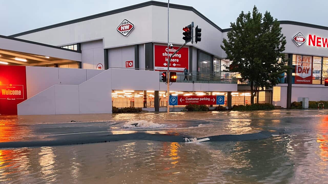 A flooded street and store in Auckland, New Zealand.