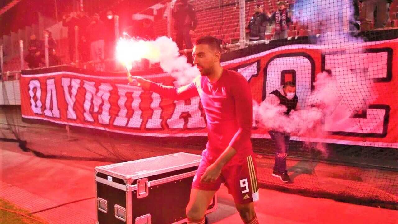Ahmed Hassan scored a brace to lead Olympiakos to a title-winning victory over Panathinaikos.