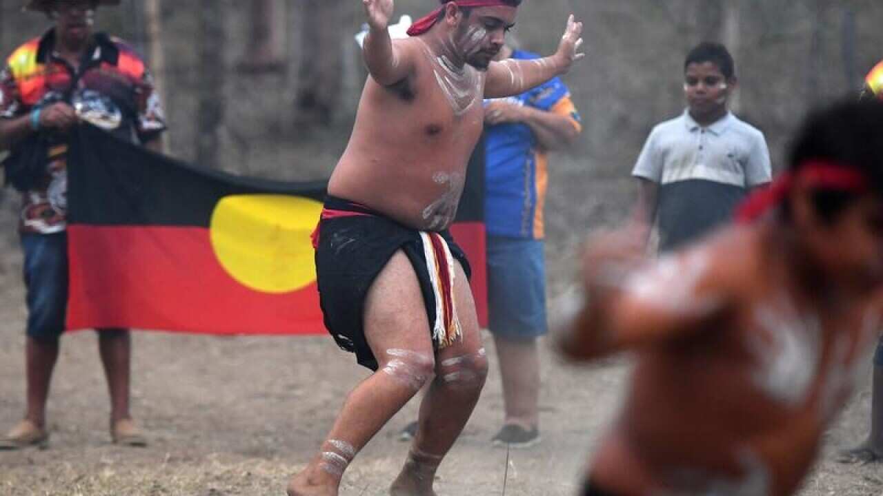 Aboriginal dancers perform a traditional dance in celebration.
