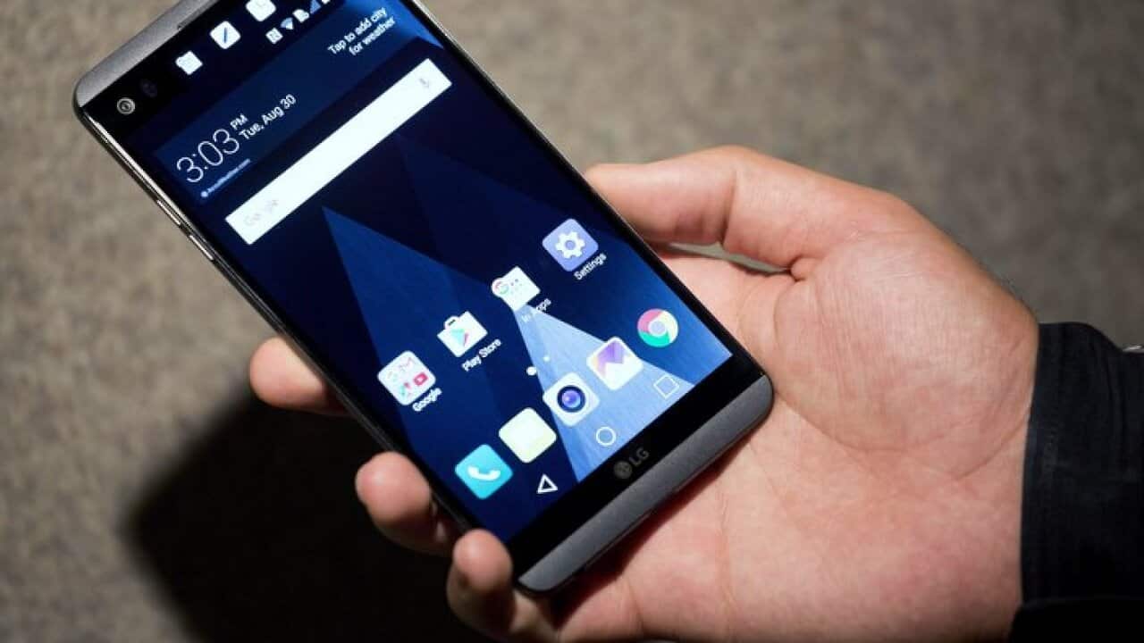 In this Tuesday, Aug. 30, 2016, photo, the LG V20 is demonstrated in New York. The most visible changes include the ability to run two apps side-by-side. (AP Photo/Mark Lennihan)