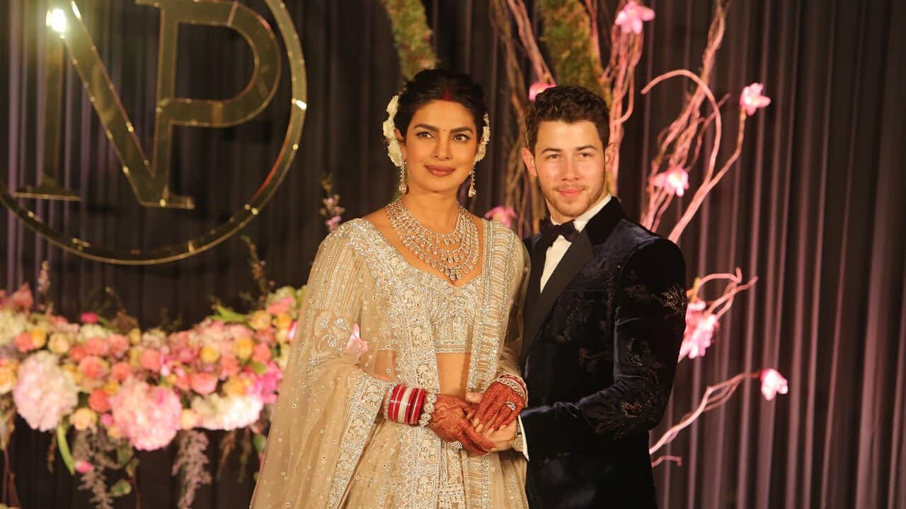 Newly-wed Bollywood actor Priyanka Chopra and American singer Nick Jonas during their wedding reception, at Taj Palace on December 4, 2018 in New Delhi, India.