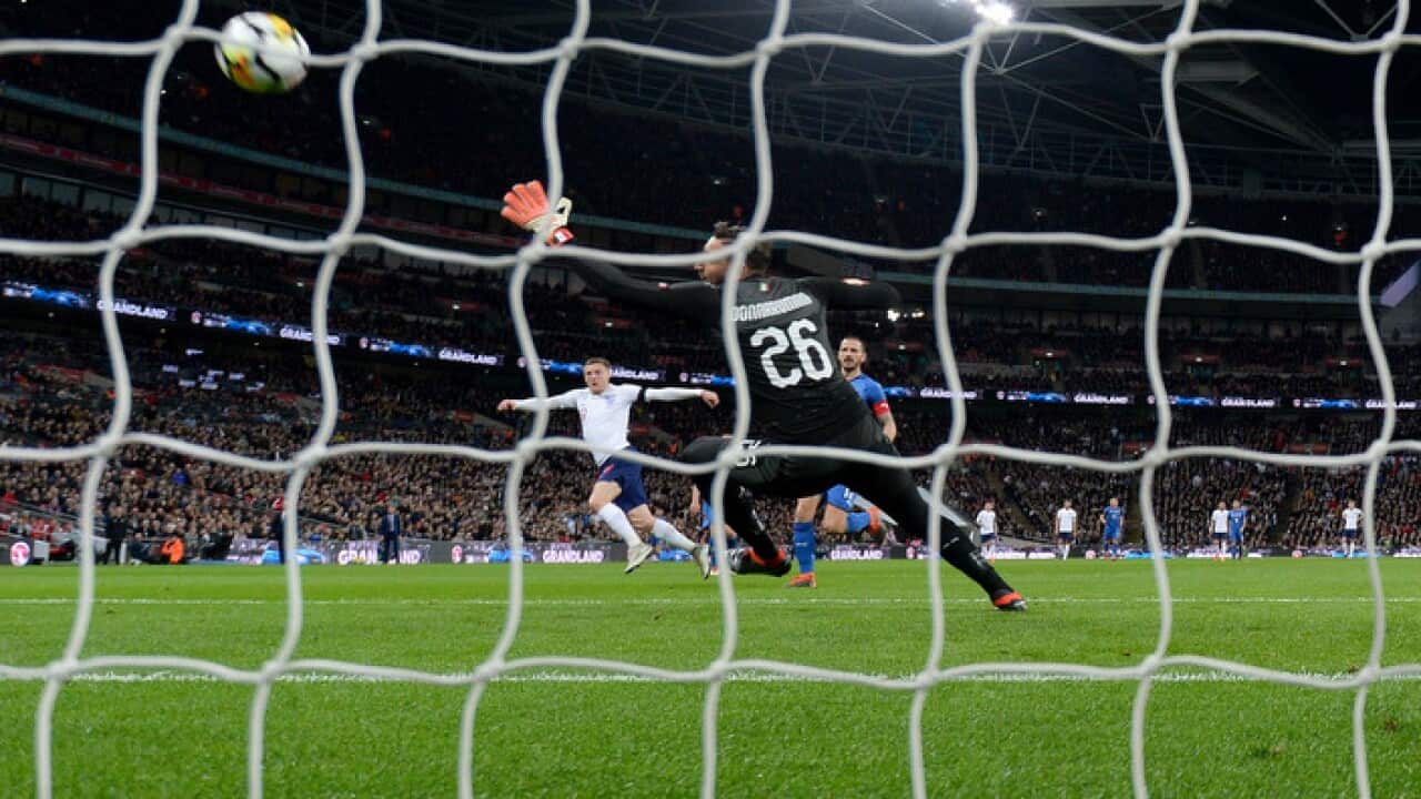 England's Jamie Vardy scores his side's first goal of the game.