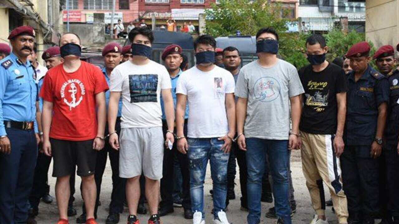 Nepal Police say the Chinese nationals are accused of using fake cards to withdraw money from ATMs in Kathmandu.