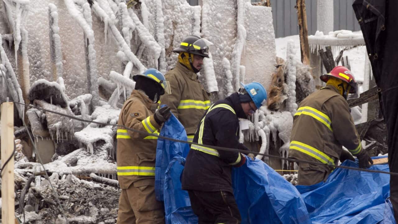 Rescuers at the scene of a nursing home fire, L'Isle-Verte, Que.