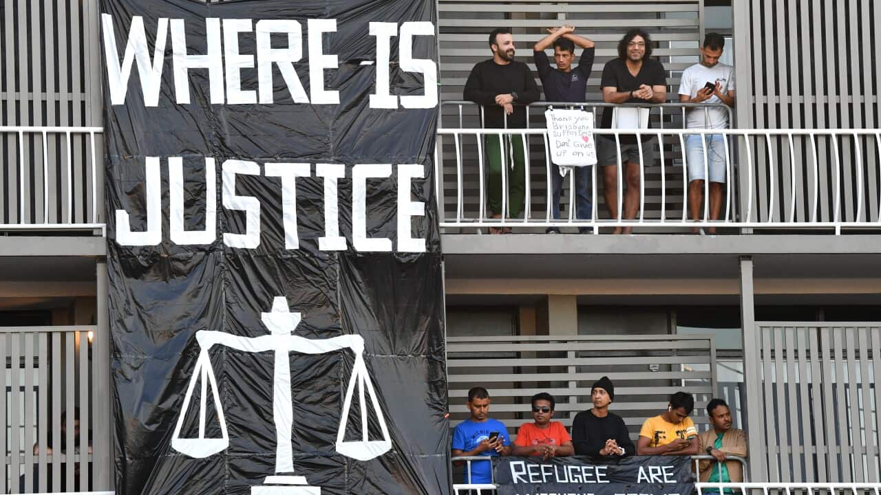 Asylum seekers inside the Kangaroo Point Central Hotel in Brisbane on Friday.