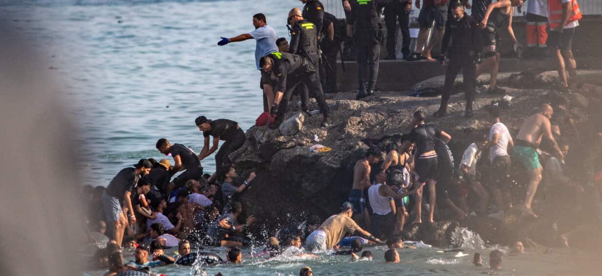 Spain calls in armed forces as hundreds of migrants enter Ceuta exclave from Morocco