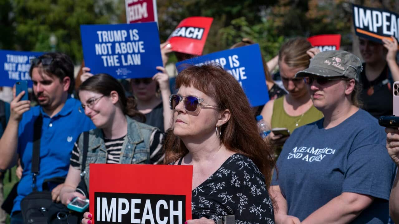 People rally for the impeachment of President Donald Trump, at the Capitol in Washington