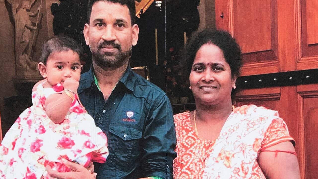 a family portrait of Sri Lankan Tamils Priya and Nadesalingam and their two Australian-born children.