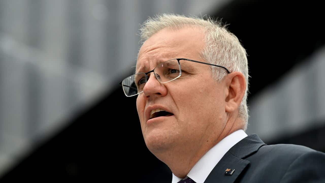 A low-angle photo of Scott Morrison who is speaking.