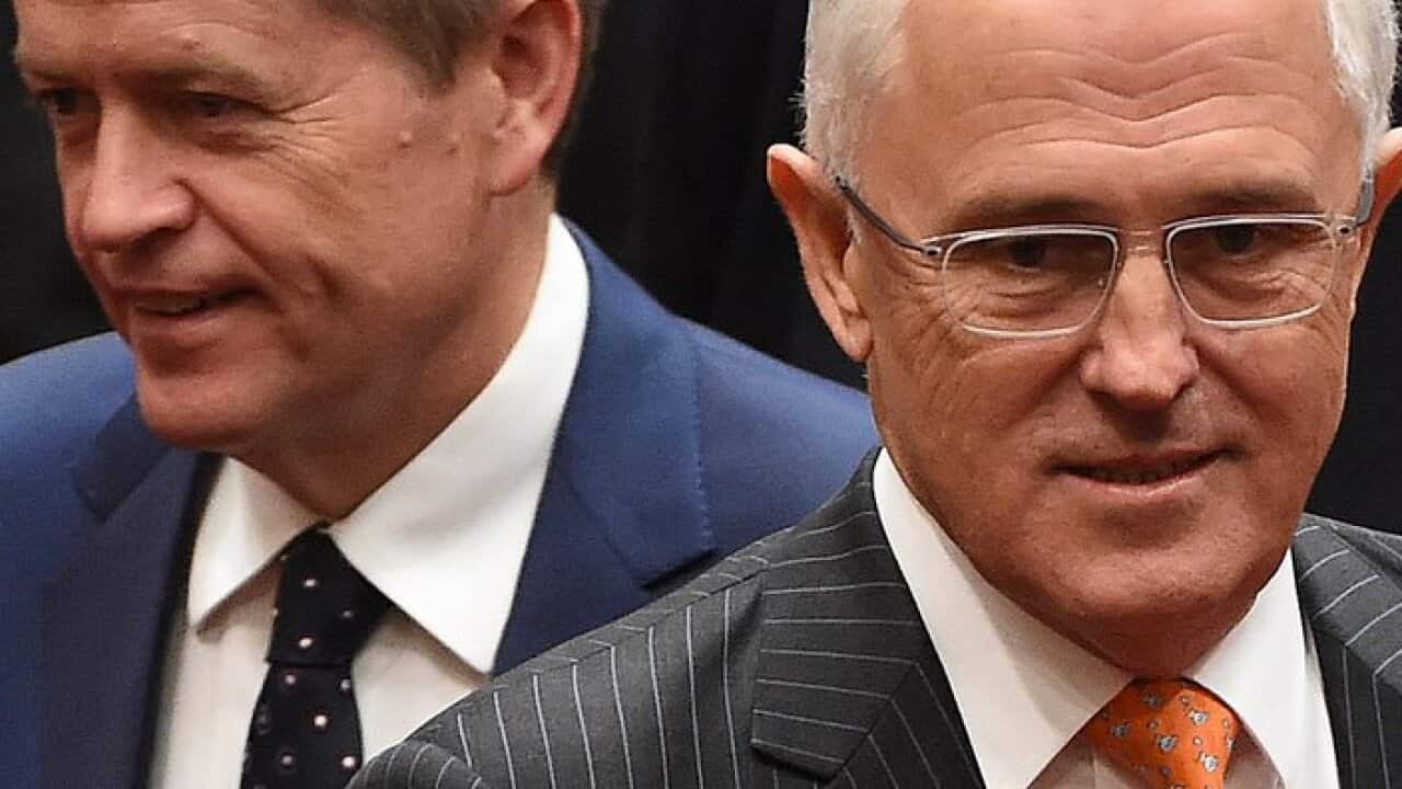 Prime Minister Malcolm Turnbull (R) and Leader of the Opposition Bill Shorten arrive during the reopening of Parliament in the Senate chamber at Parliament House in Canberra on Monday, April 18, 2016. (AAP Image/Mick Tsikas) NO ARCHIVING