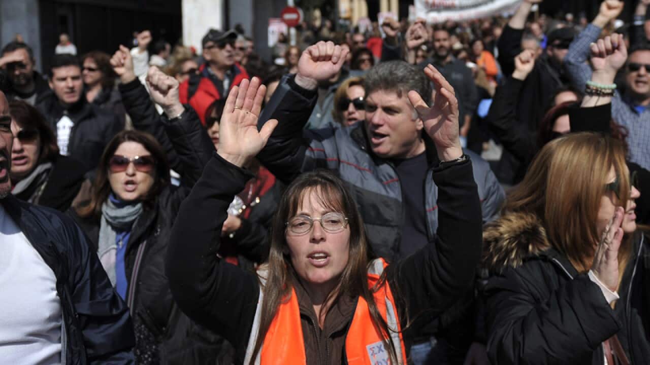 Public sector employees shout slogans during a demonstration