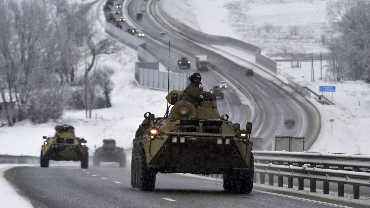 A convoy of Russian vehicles moves along a highway in Crimea.