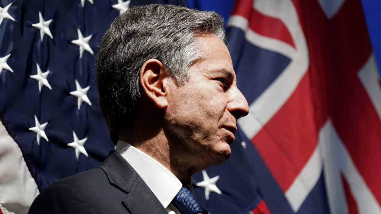 U.S. Secretary of State Antony Blinken listens as he is introduced to speak at a mission Australia meet and greet in Melbourne, Australia, Thursday, Feb. 10, 2022. (Kevin Lamarque/Pool Photo via AP)