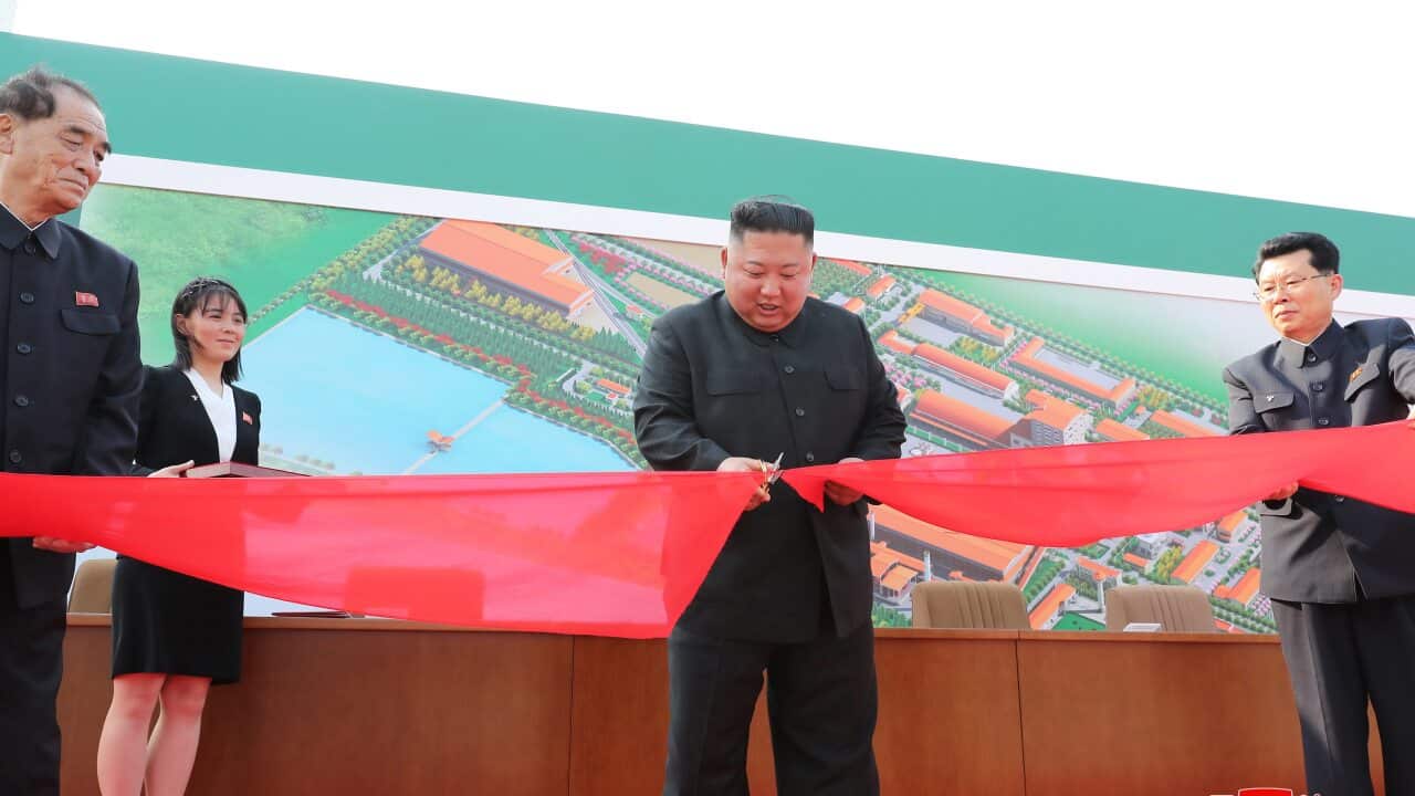 Kim Jong-un cutting a ribbon at what is reportedly his first public appearance in 20 days.