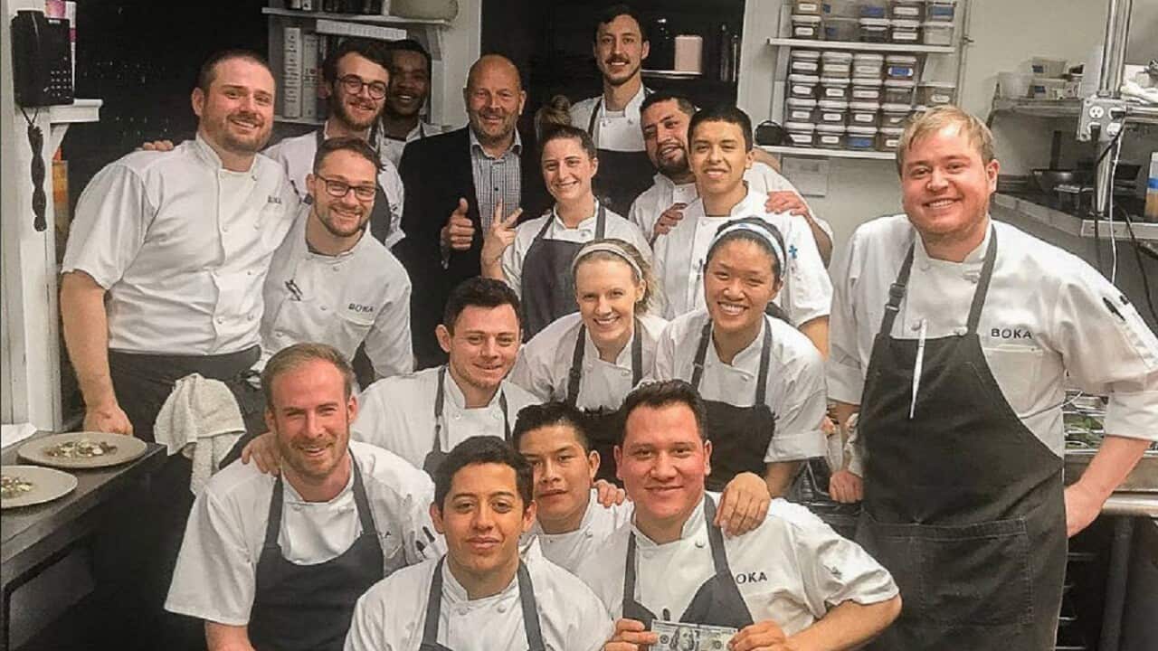 The staff of Boka Chicago with their happy customer.