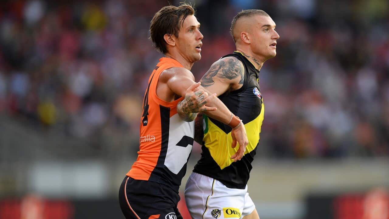 Matt de Boer of the Giants and Dustin Martin of the Tigers in Round 3
