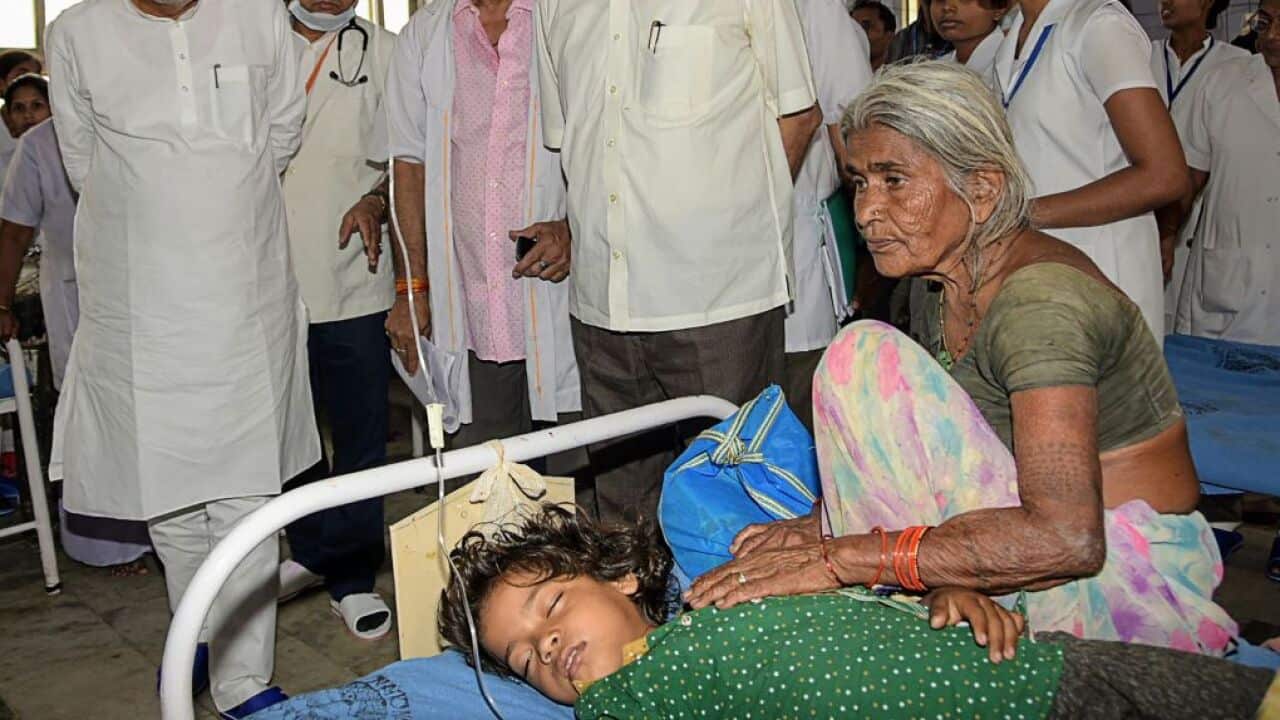 Bihar Chief Minister Nitish Kumar (L) visits a hospital as more than 150 children lost their life due Acute Encephalitis Syndrome.