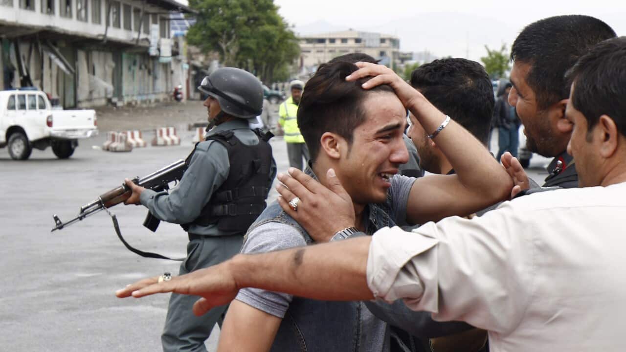 An unidentified relative of one of the victims, who was killed in a suicide bomb blast that targeted the Ministry of Defense in Kabul, Afghanistan.