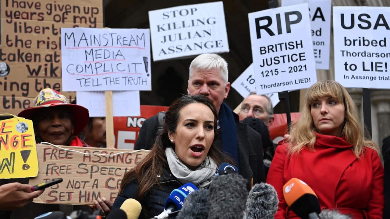 Partner of Wikileaks founder Julian Assange, Stella Moris (C) speaks to the media outside the High Court in London, 24 January 2022.