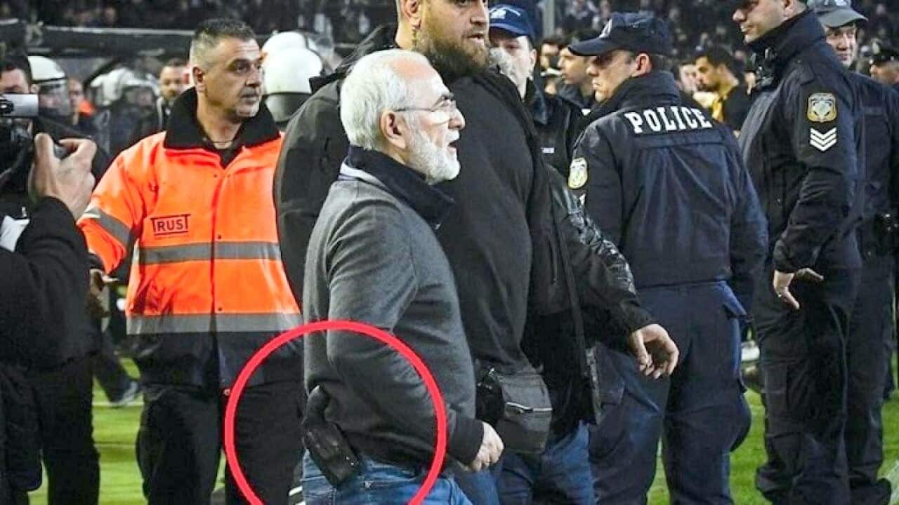 PAOK-AEK game halted as gun-toting PAOK president Ivan Savidis leads protests over disallowed goal.