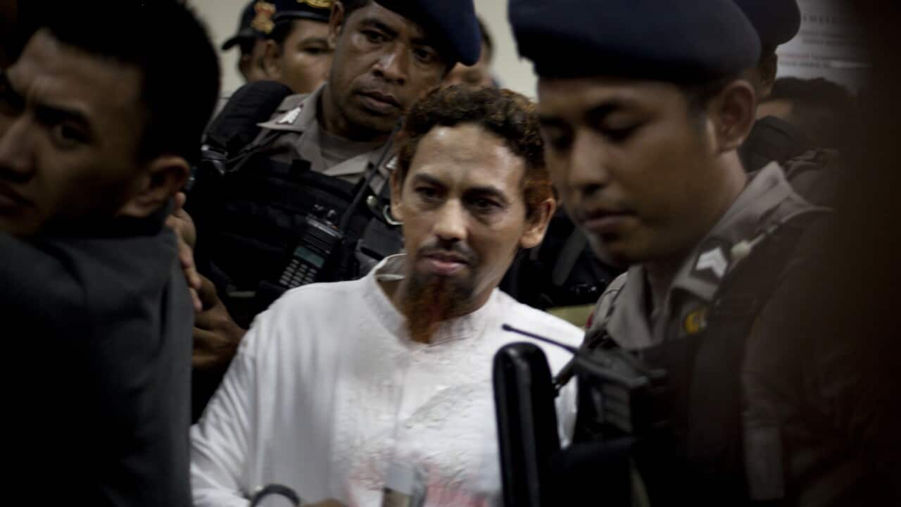 Indonesian militant Umar Patek leaves West Jakarta Court under police escort