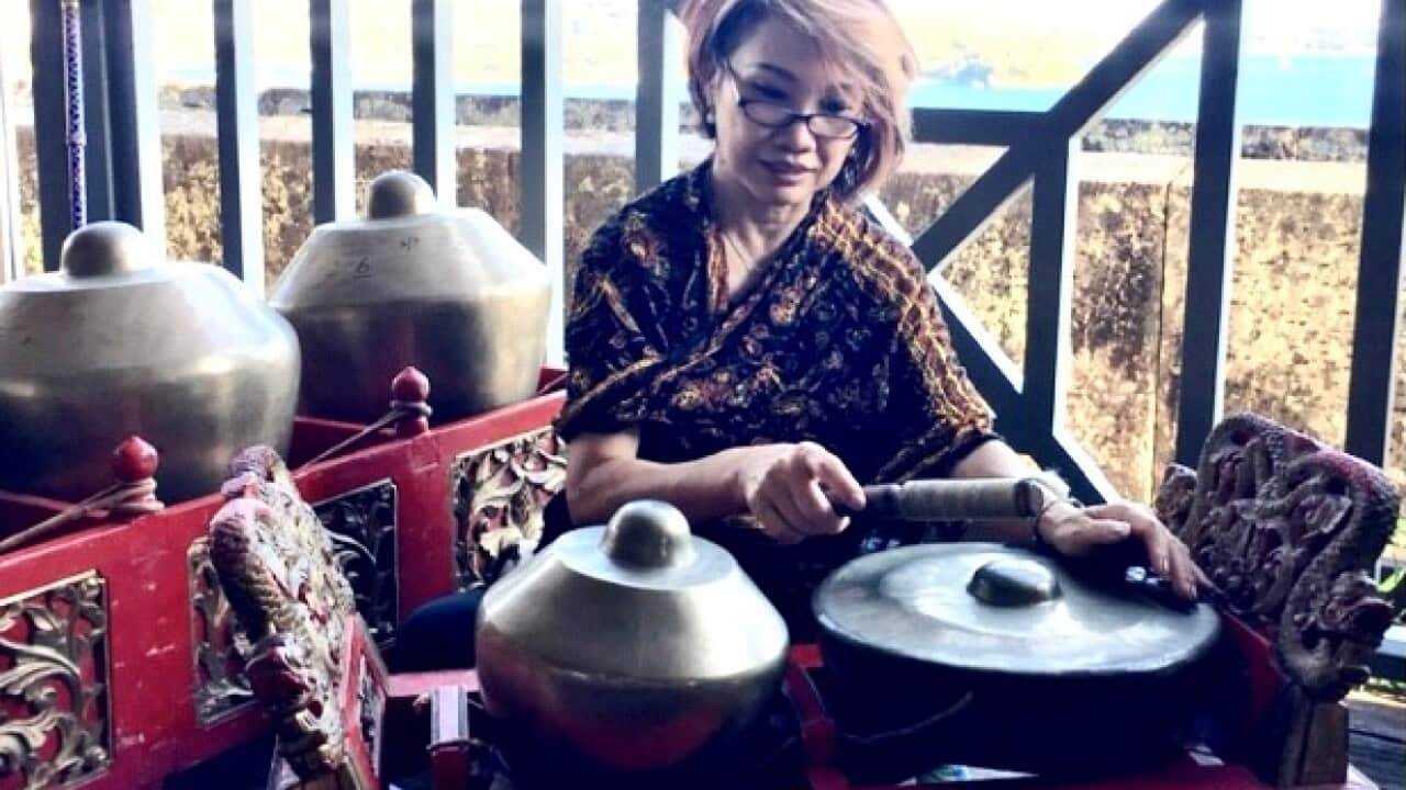 Lucy Surtandi loves music. She is playing ketuk kempyang with Langen Suka gamelan group.