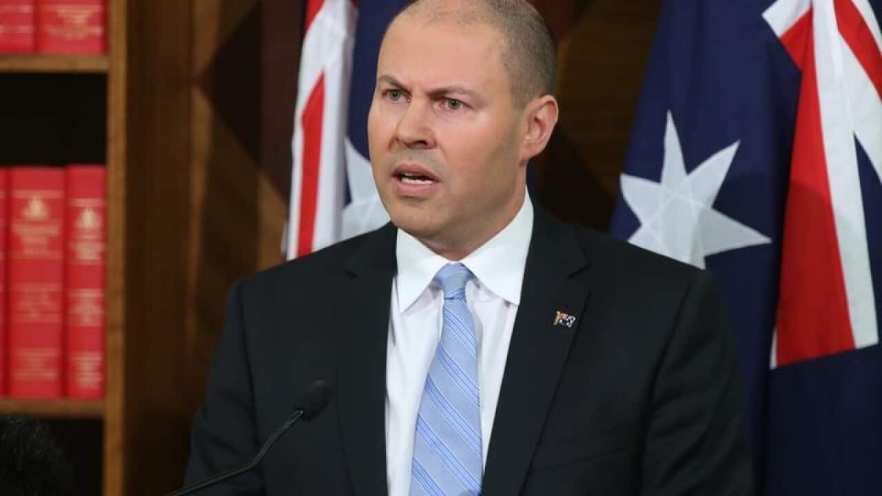 Treasurer Josh Frydenberg speaks at a press conference in Melbourne.