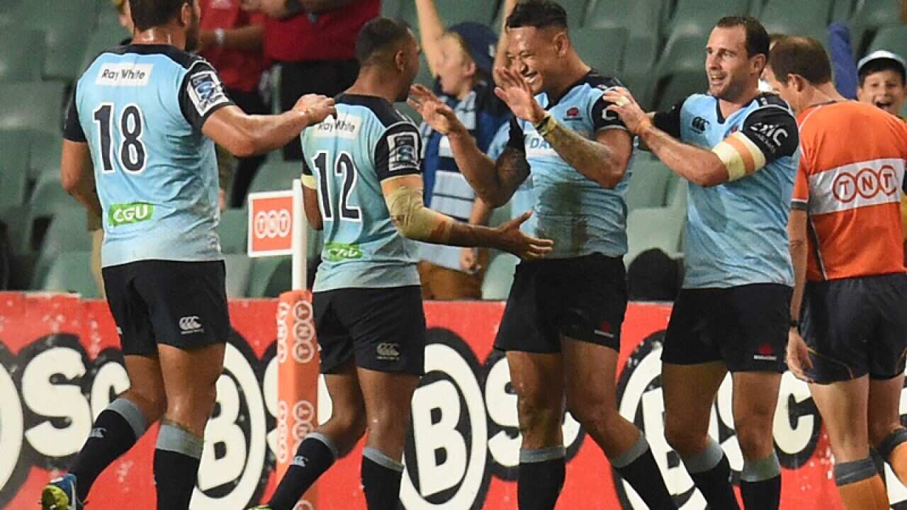 NSW Waratahs players celebrate after scoring a try
