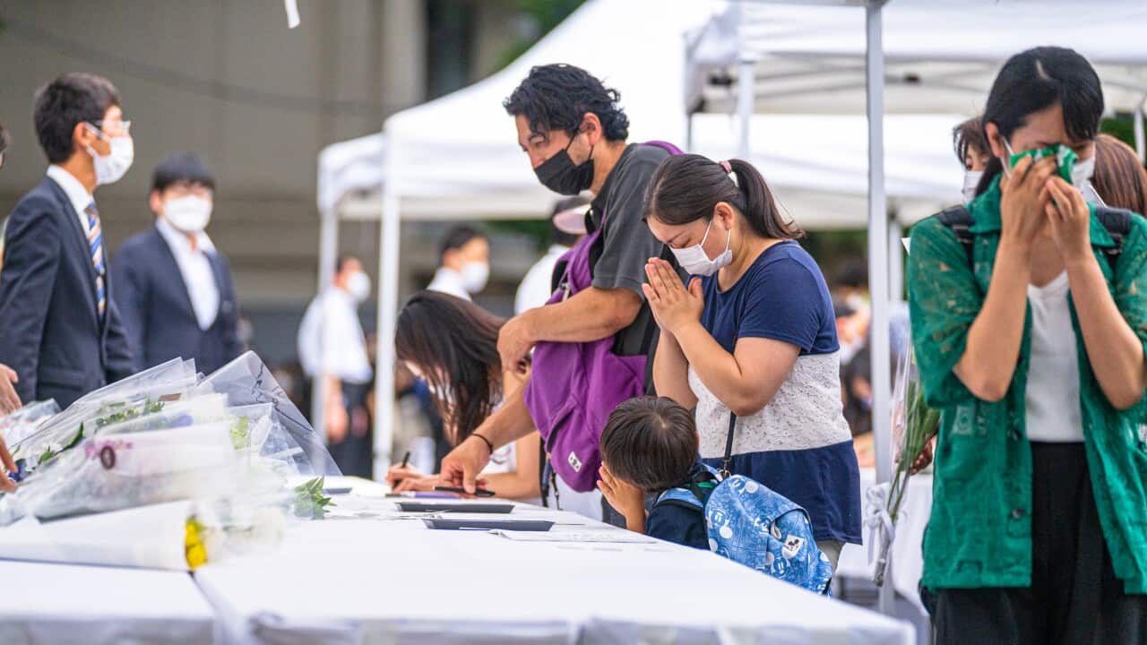 People bring flowers to pay respect for Shinzo Abe