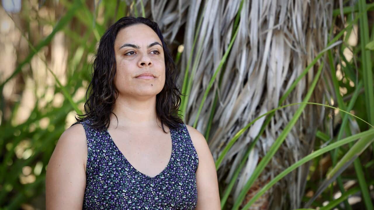 Danggalaba Kulumbirigin Tiwi woman Mililma May seen standing in front of plants