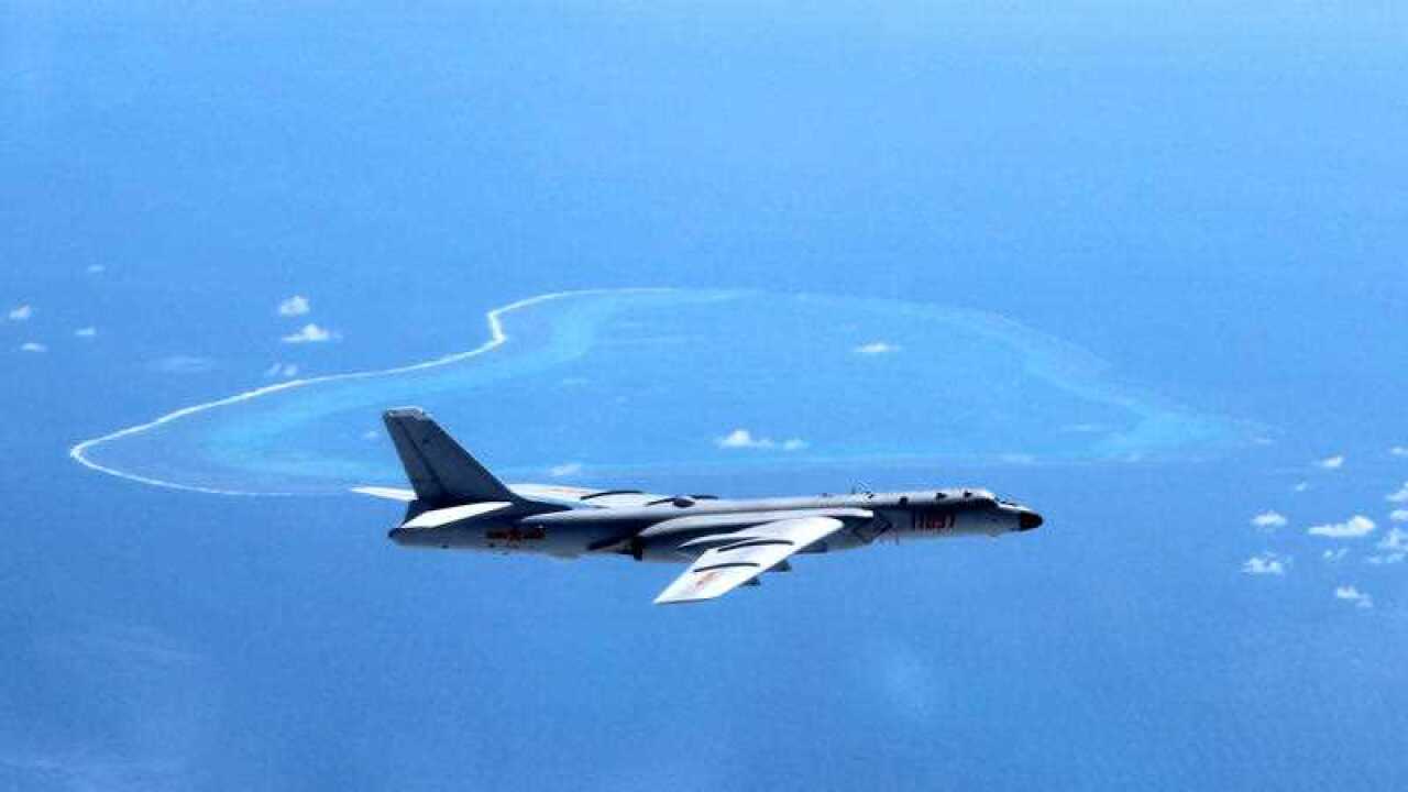 In this undated file photo released by Xinhua News Agency, a Chinese H-6K bomber patrols the islands and reefs in the South China Sea.