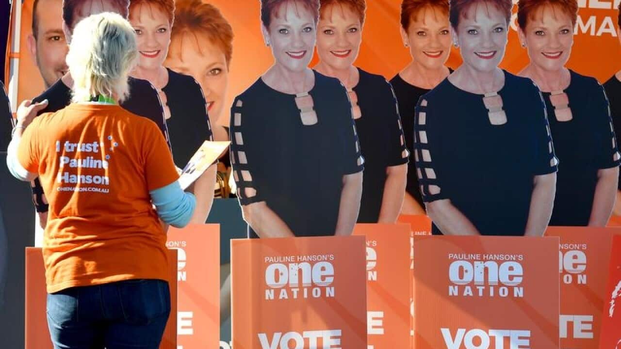 Cardboard cutouts of One Nation leader Pauline Hanson at a booth.