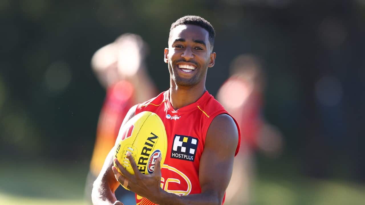 Hewago Oea during a Gold Coast Suns AFL training session at Metricon Stadium