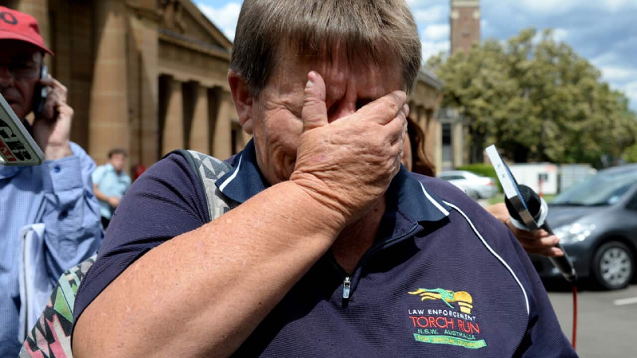 Sue Patterson, mother of Warren Ross, is overcome as she leaves court