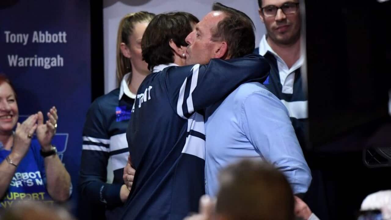 Former Prime Minister and Warringah Liberal candidate Tony Abbott kisses his wife Margie Abbott after conceding defeat