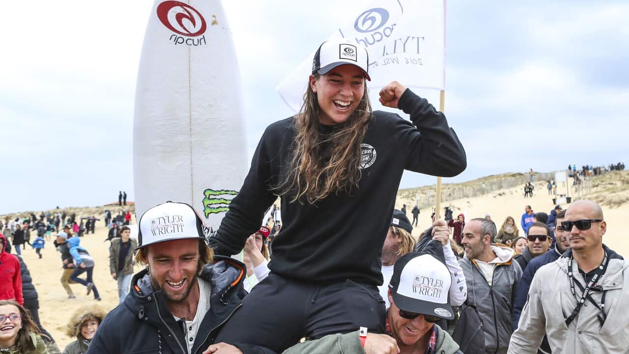 Tyler Wright celebrates her maiden World Title victory at the Roxy Pro France.