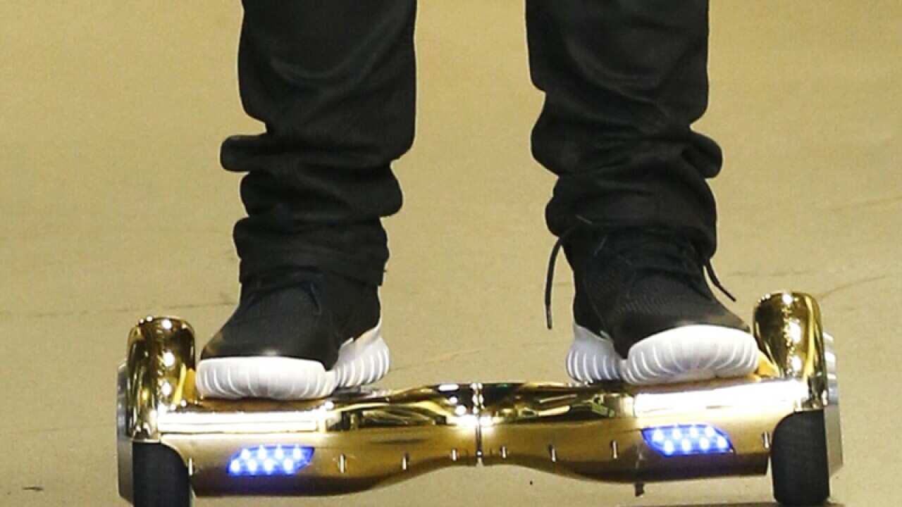 A man rides a hoverboard