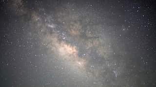 The Milky Way galaxy, a mass of stars and clouds in space.