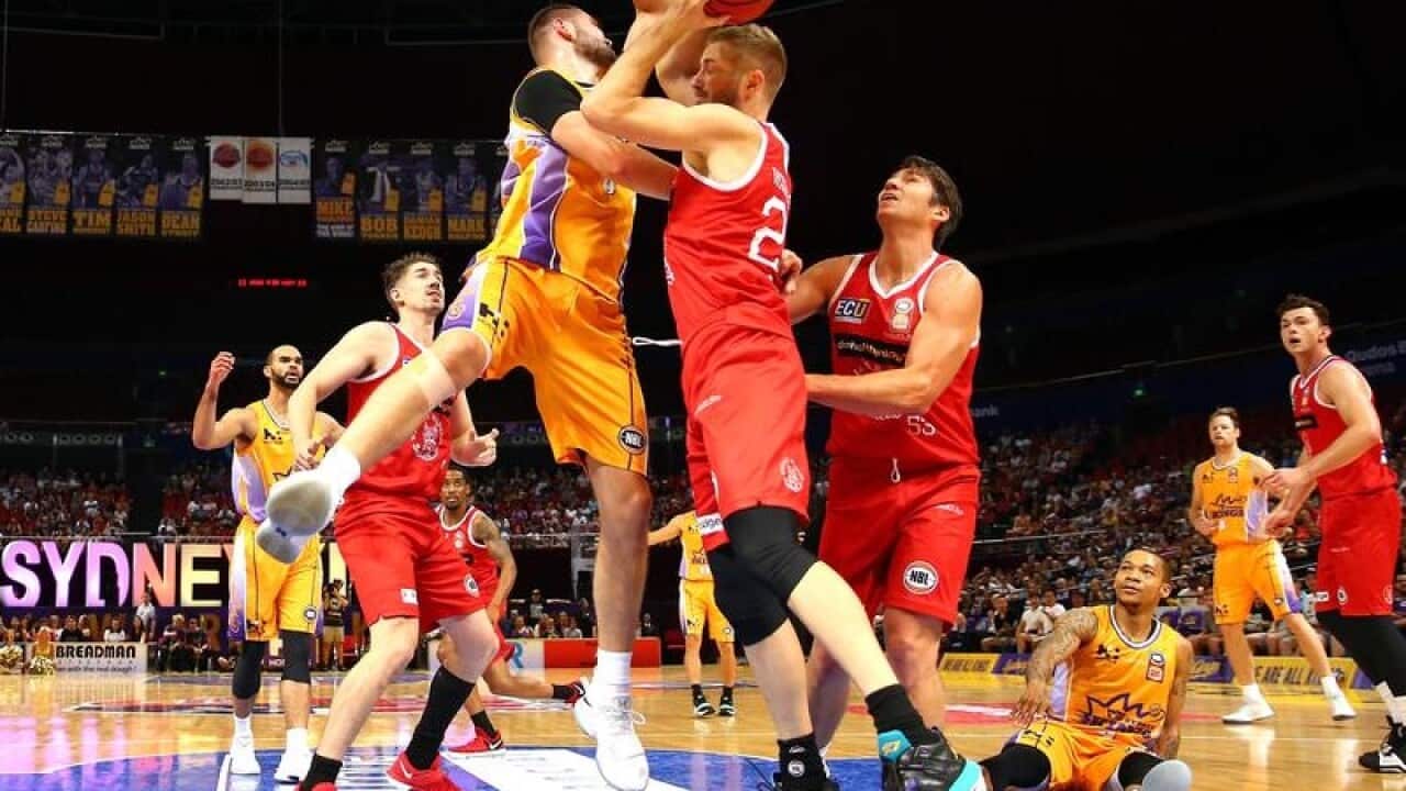 Isaac Humphries of the Kings and Jesse Wagstaff of the Wildcats